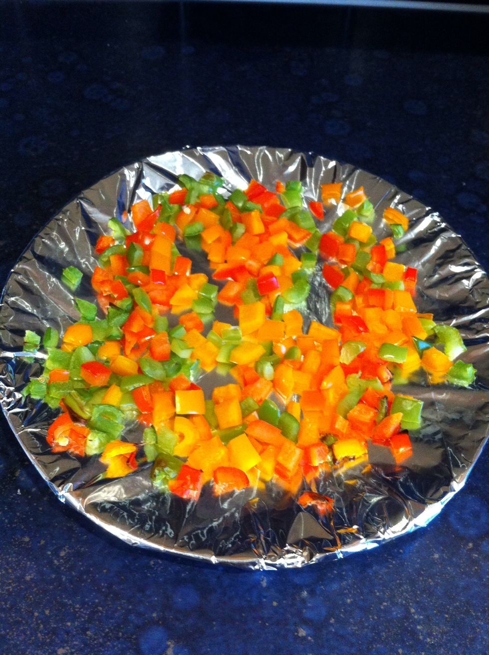 Grill the peppers to lightly cook them for 10 minutes at 200 degrees Celsius