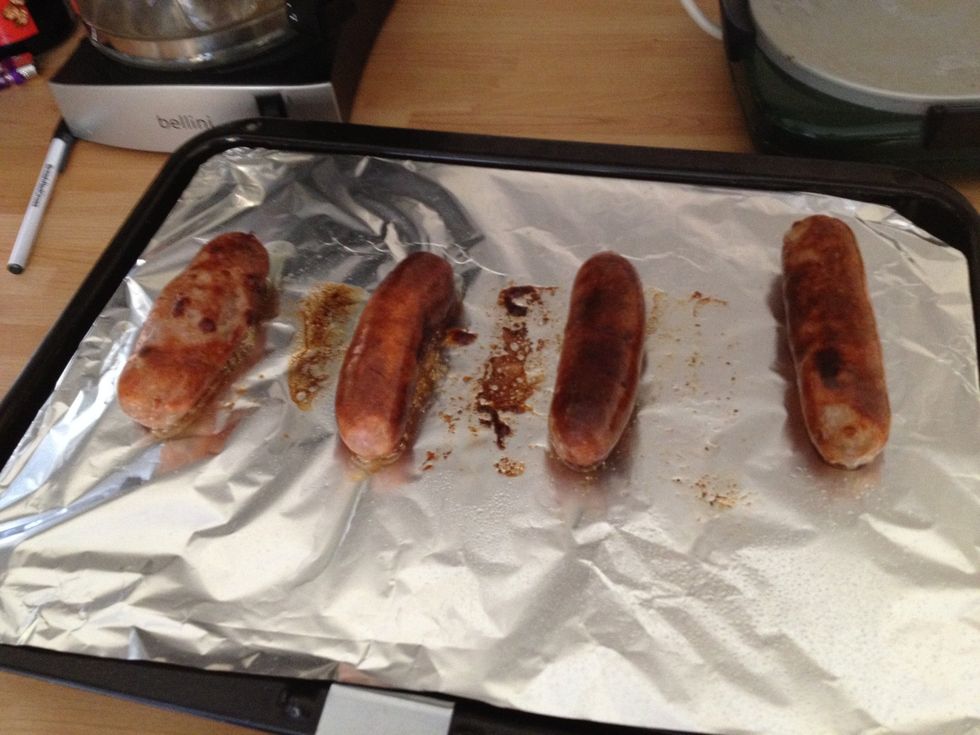 Grill the sausages turning them over occasionally when needed till they are brown. If they are black take a photo and tweet it because black sausage fails look funny.