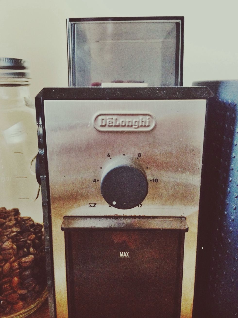 Grind beans on espresso setting. If the shot pours out too fast (shorter than 14 seconds), the grind is too coarse. If the pull is too slow (longer than 20 seconds), the grind is too fine.