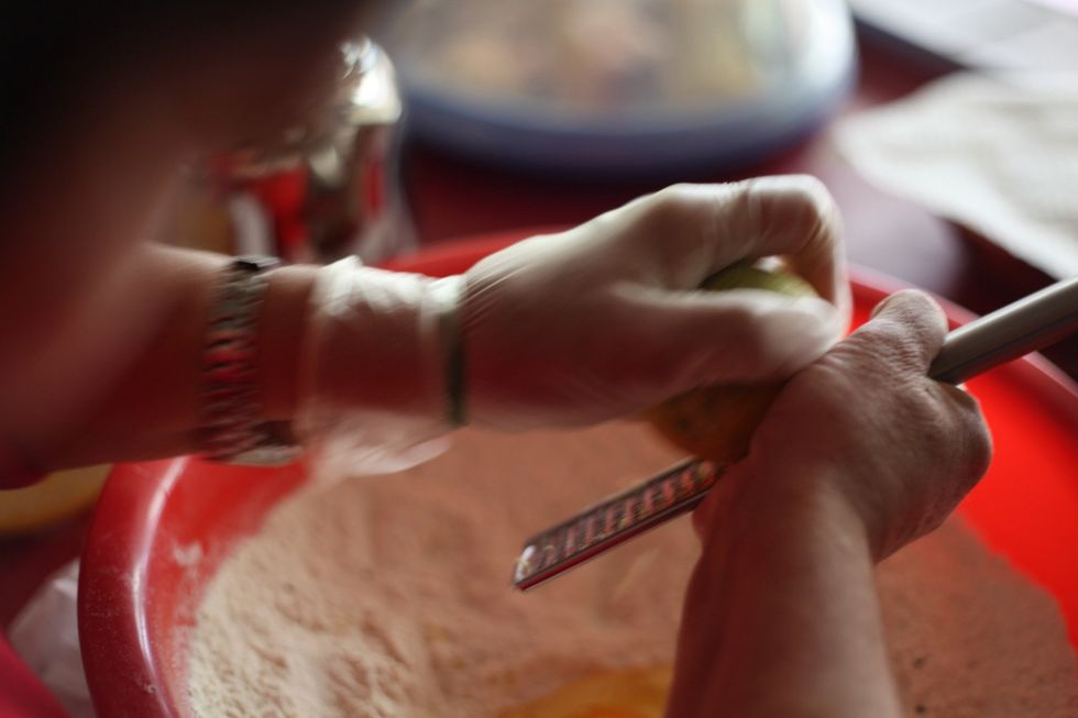 Grind lemon onto the egg for the smell. For those who wonder why we grind lemon into all recipes that use egg? There's a smell when you cook with egg that Lebanese can't stand. This is how to avoid it