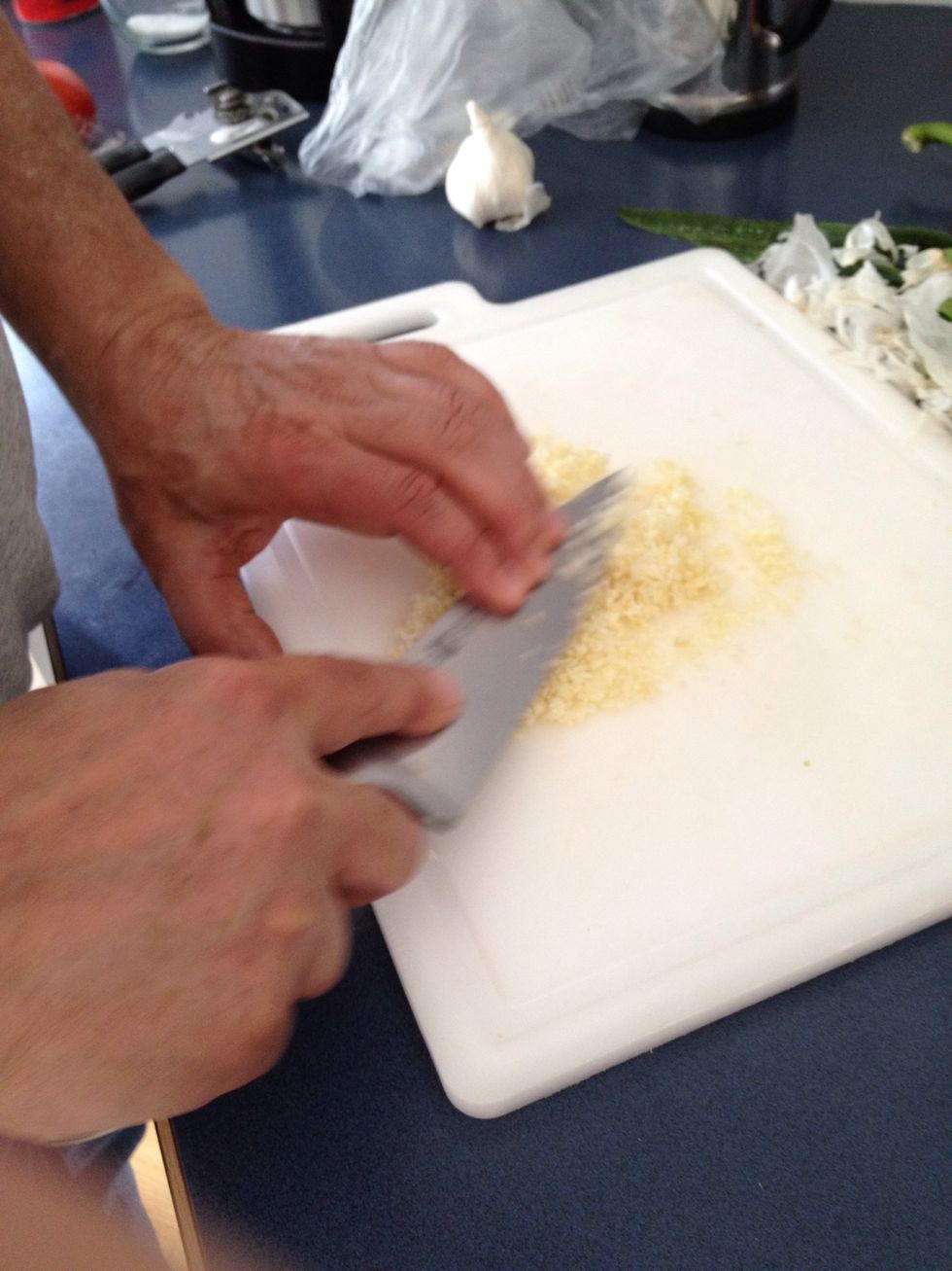 Grind salt with garlic