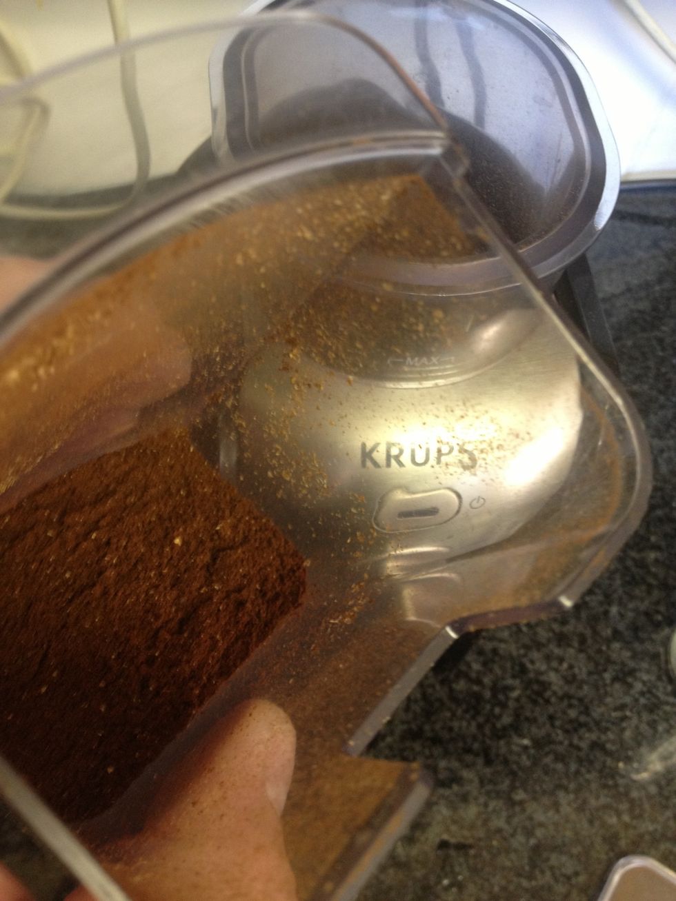 Grind the beans fairly finely (I grind a little coarser than espresso) in a burr grinder. I use a cheap Krups GVX2 on its finest setting.