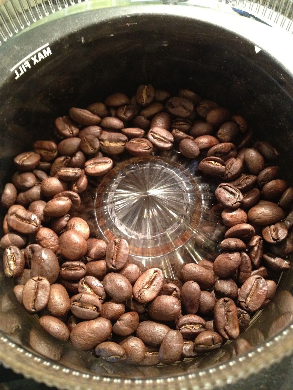 Grind the coffee, preferably with a conical burr grinder.