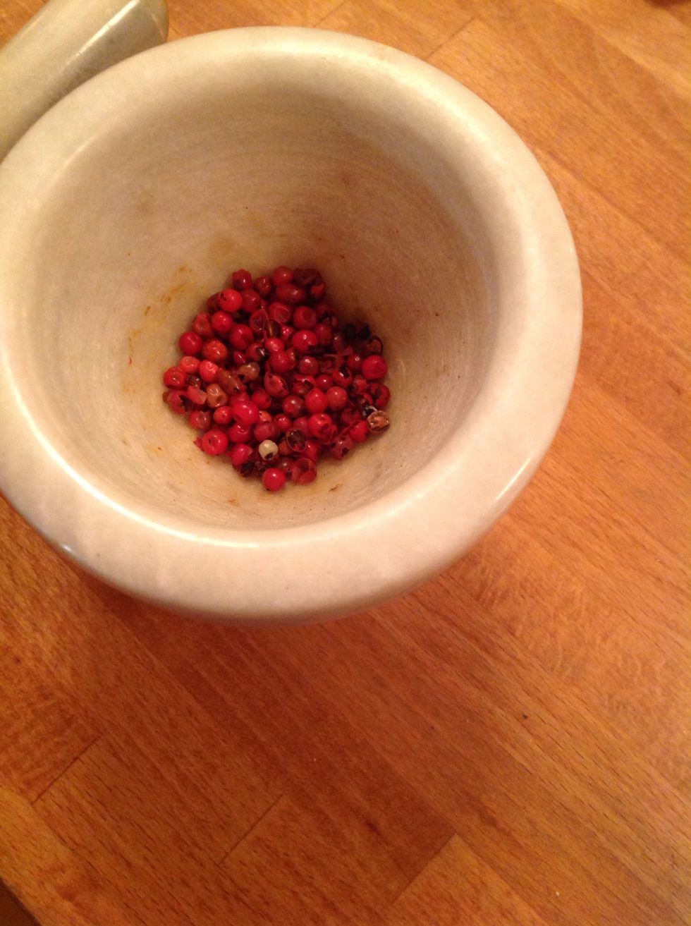 Grind the pink peppercorns.