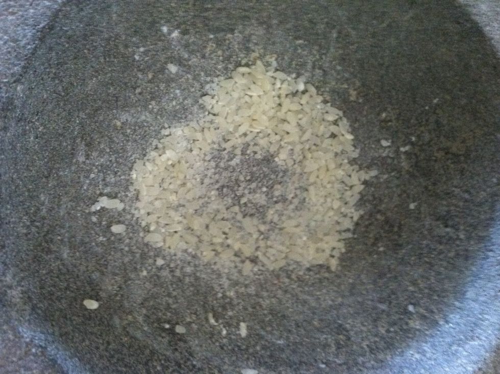 Grind the rice grains against the bottom of bowl