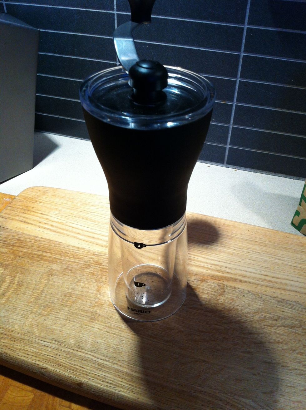 Grind your beans at the very last minute. I use a Hario Slim conical burr hand mill, 2-3 clicks from the finest setting. If you have pre ground go for the espresso grind.
