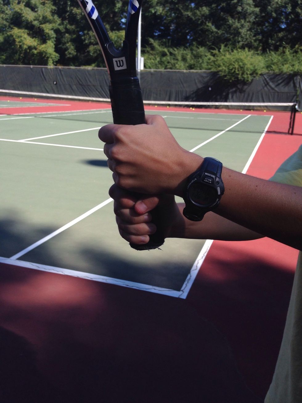 Grip position. Have your less dominant hand on top and have your dominant hand on bottom. This is called a continental grip.