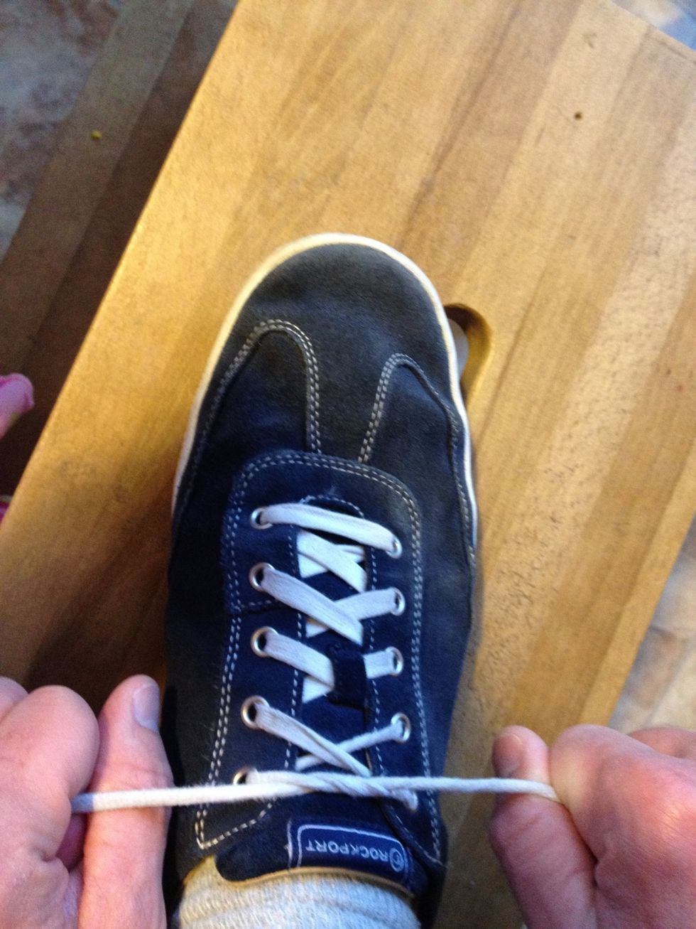 Grip the laces like handlebars. Squeeze tight with your pinkies.