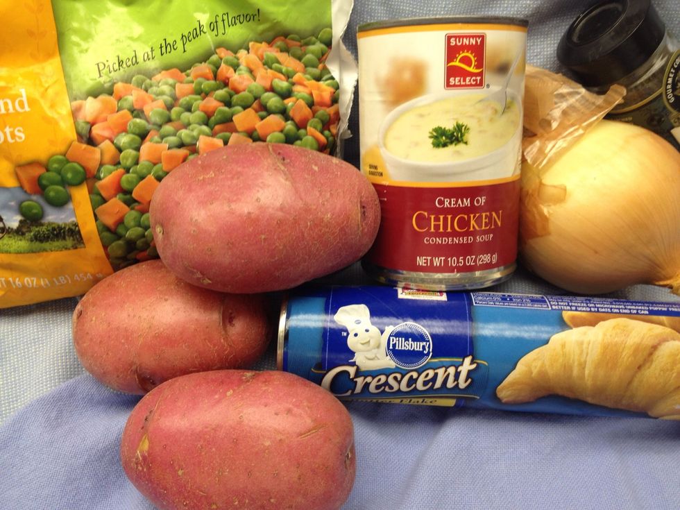 Groceries: 1 bag frozen peas &  carrots, 1 bag frozen potatoes with onions, (I already had potatoes and an onion so I used those) 1 can cream of chicken soup, 16oz crescent rolls, and ..
