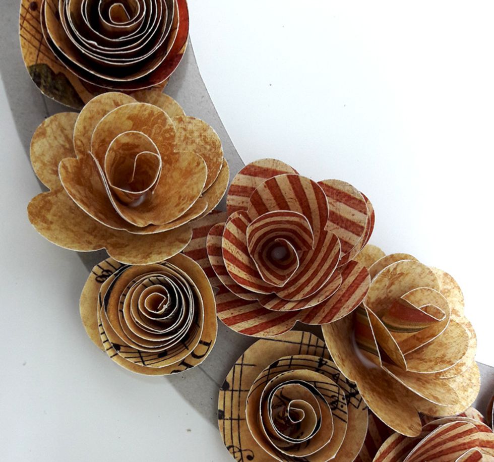 Group flowers together to cover chipboard.