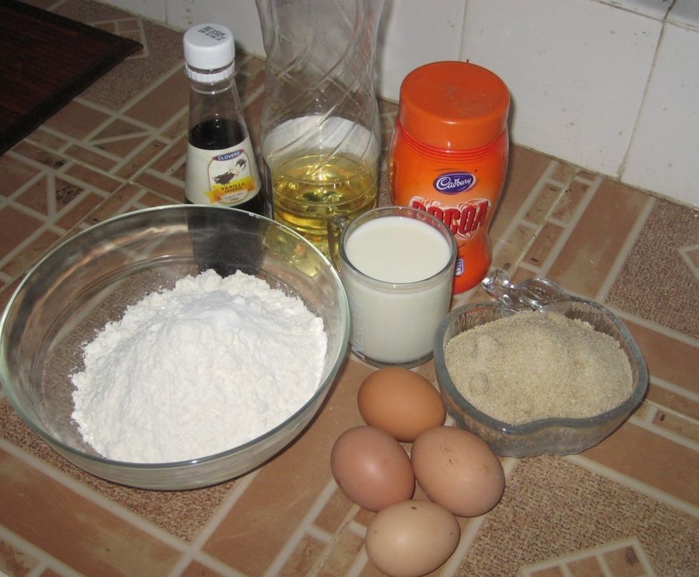 Group photo of the ingredients. Flour, vanilla essence/extract, oil, milk, sugar, eggs. If using ordinary flour, add 1 1/2 tsp of baking powder.