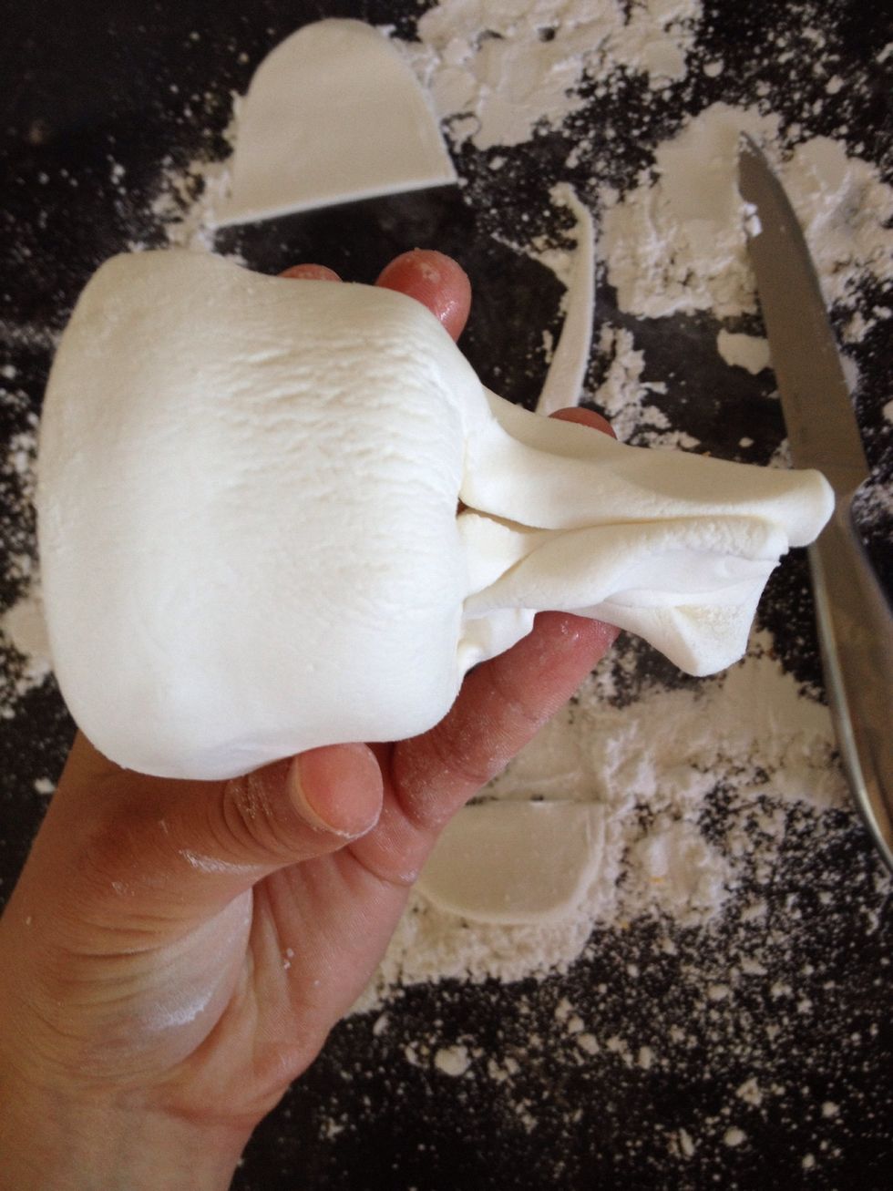 Group the fondant at the base of the cupcake.