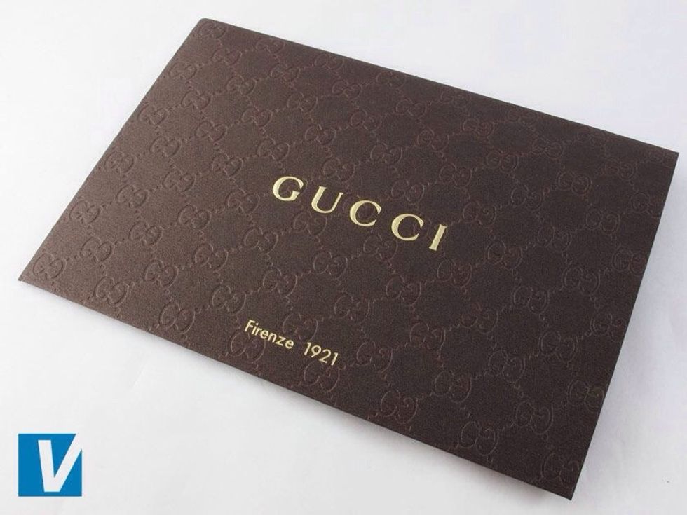 Gucci shoes sometimes come with a Firenze 1921 card. They are brown with the gold logo across the middle and Firenze 1921 written below that. The card will have the double 'GG' logo embossed.