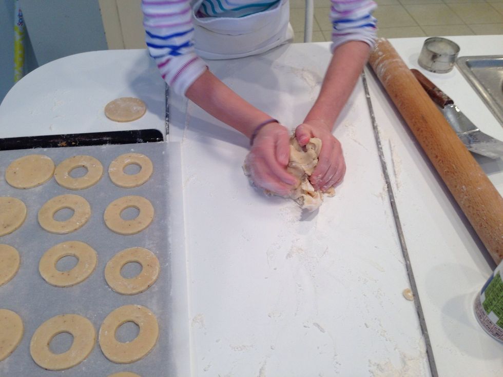 Hadley is gathering the dough up to put back in the fridge. It needs to get chilled to make it easier to roll, but also to relax the gluten. Tense gluten makes tough cookies but fabulous bread.