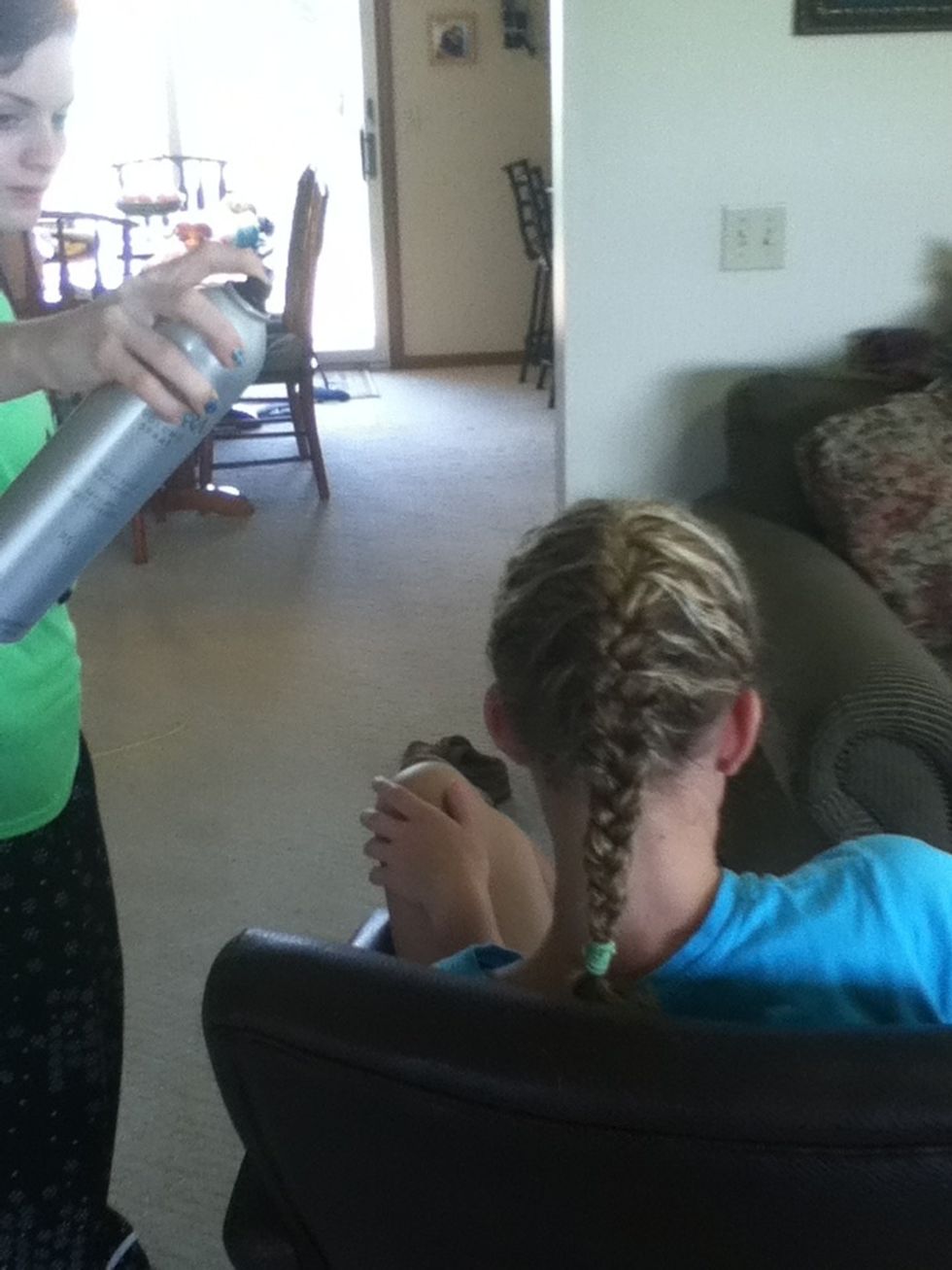 Hair spray any fly-aways.