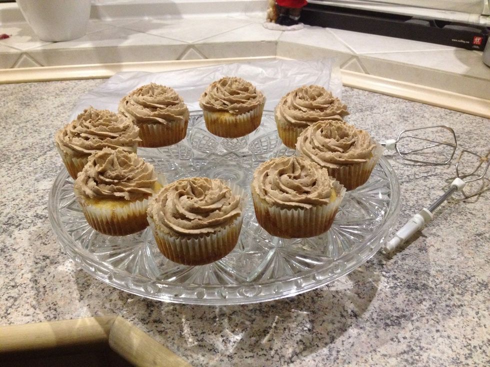 Half of the cupcakes baked and frosted