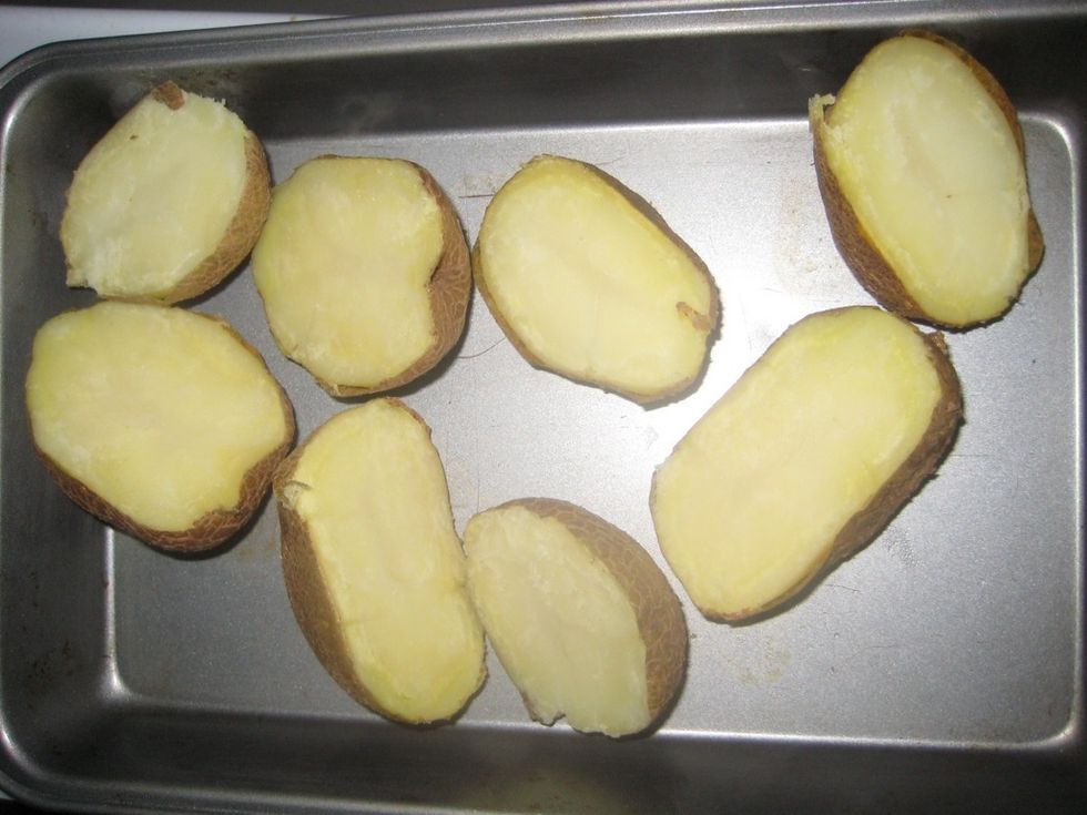 Half the cooked potatoes when they are still hot but comfortable to handle