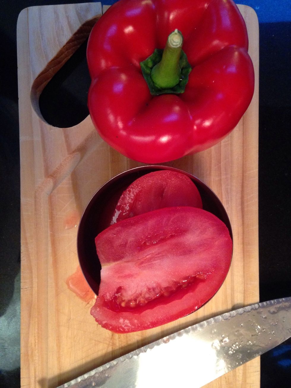 Half the tomato lengthwise