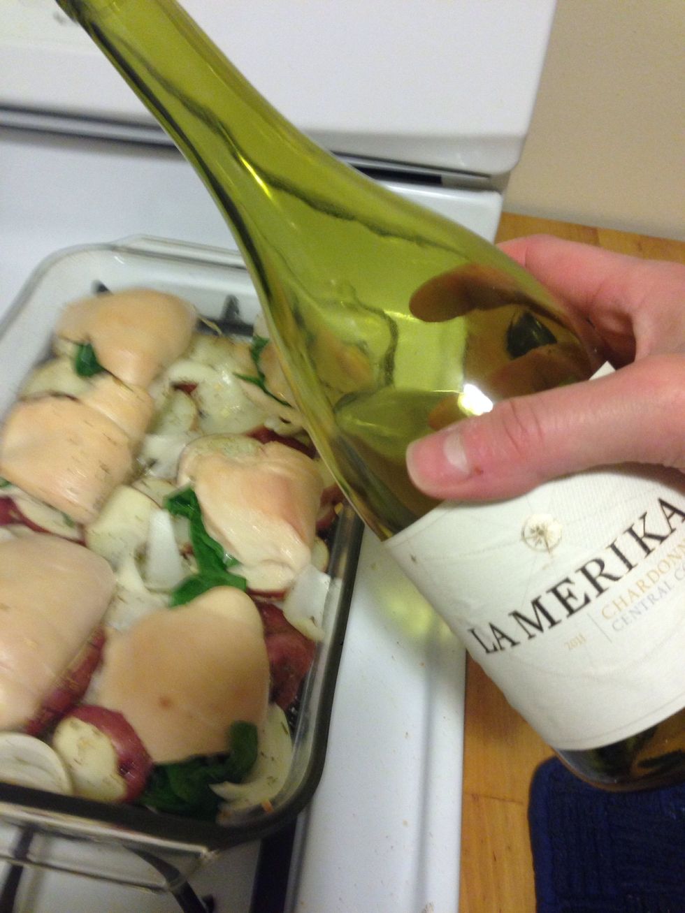 Halfway through the 35 minutes, flip the breasts over and add 1/4 c of white wine.