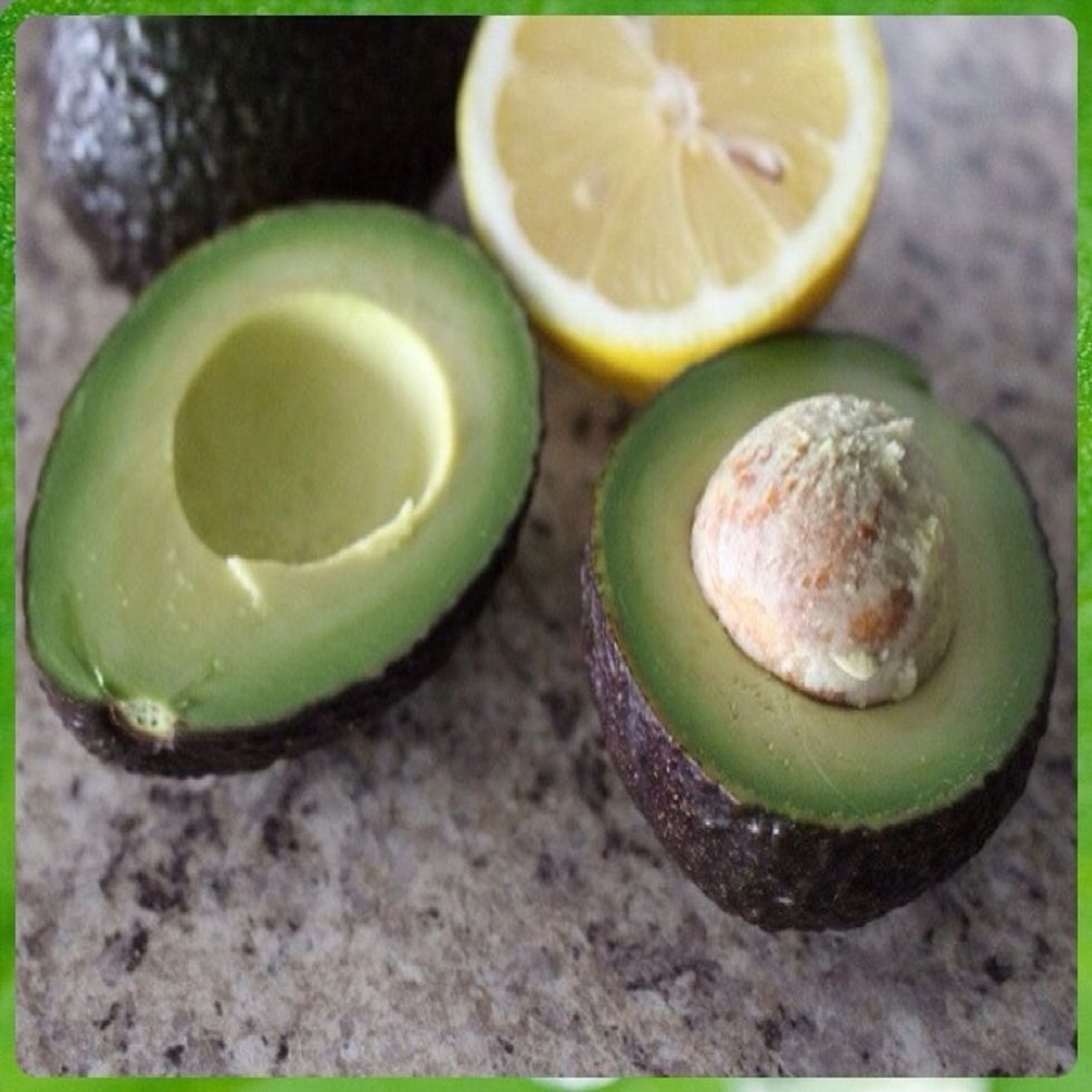 Halve the avocados lengthwise and remove pits.
