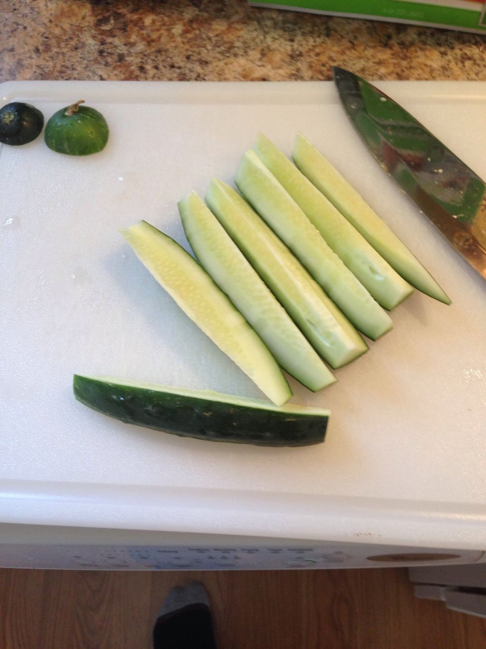 Halve the cucumber, and cut each half into 3 or 4 spears. Try to keep them even.
