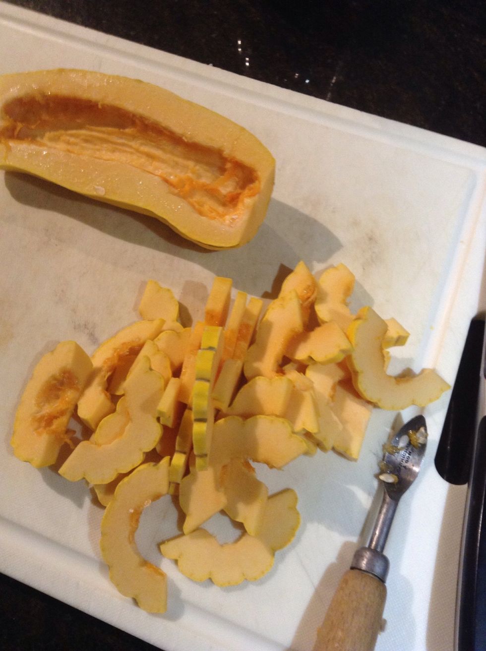 Halve the Delicata squash remove seeds and slice each half into 1/4" slices as shown.