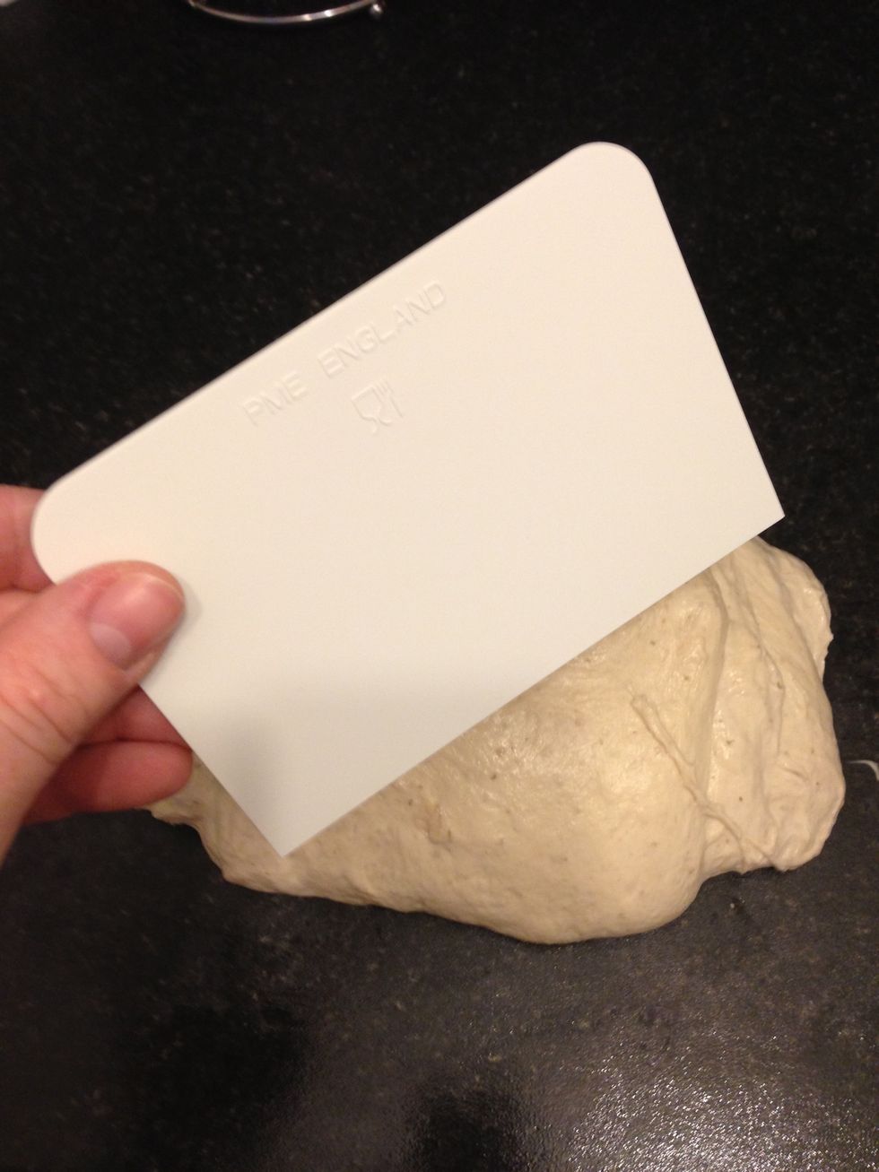 Halve the dough. I use a flat plastic tool for this.