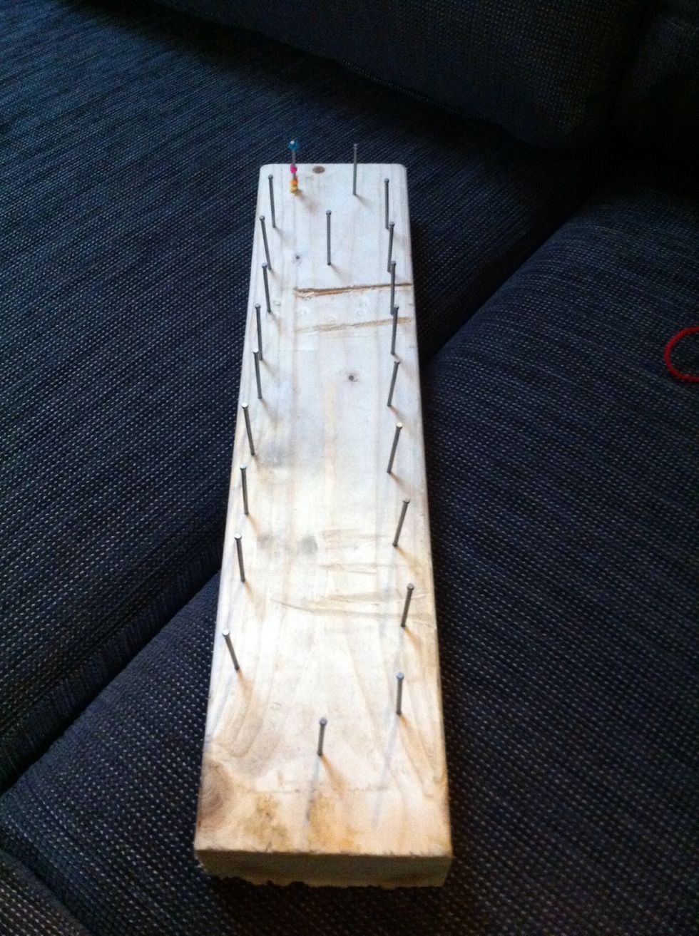 Hammer in nails on an angle of 60-70 degrees at even spaces. I just guesstimated mine. The random nail in the middle was when I just wanted to make 5 test ones at a time.