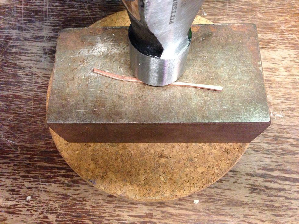 Hammer the piece until it is flat, about half it's thickness.