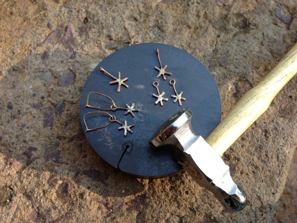 Hammer the starburst to taste. Tap the "stem" to harden the heat-softened wire without flattening it. File all snaggles.