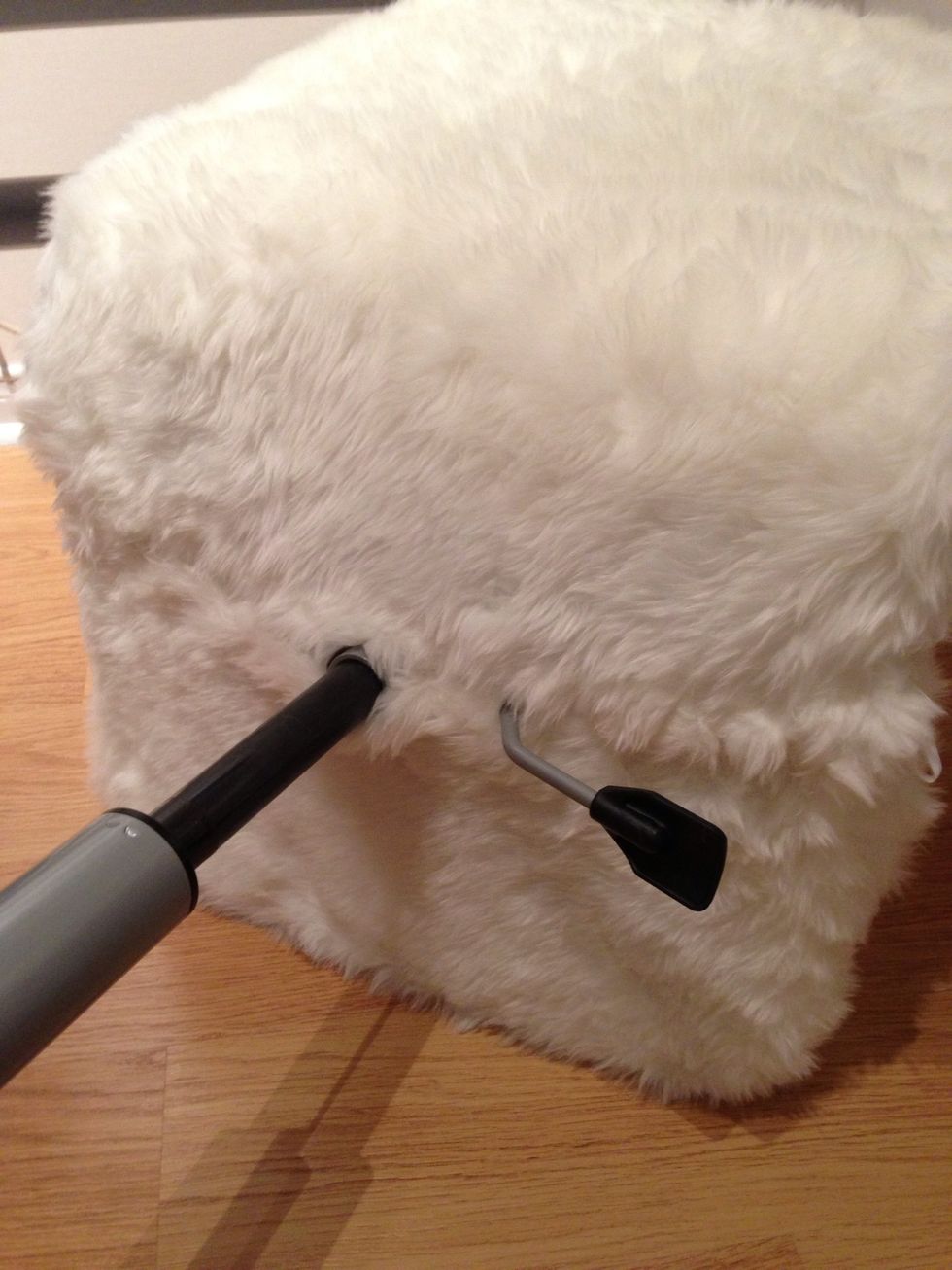 Hand sew the fabric together on the bottom of the chair sewing around the base & handle.