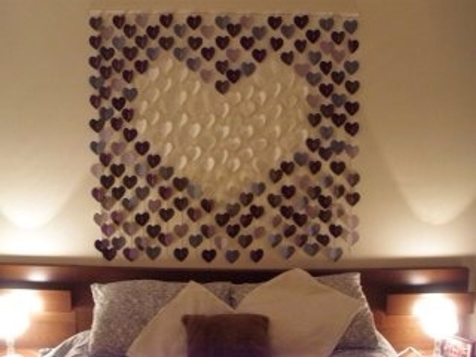 Hang over your bed and enjoy. You may want to tape the bottom of the strands to the wall too.