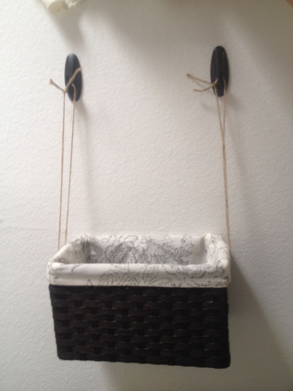 Hang the basket on the hooks.