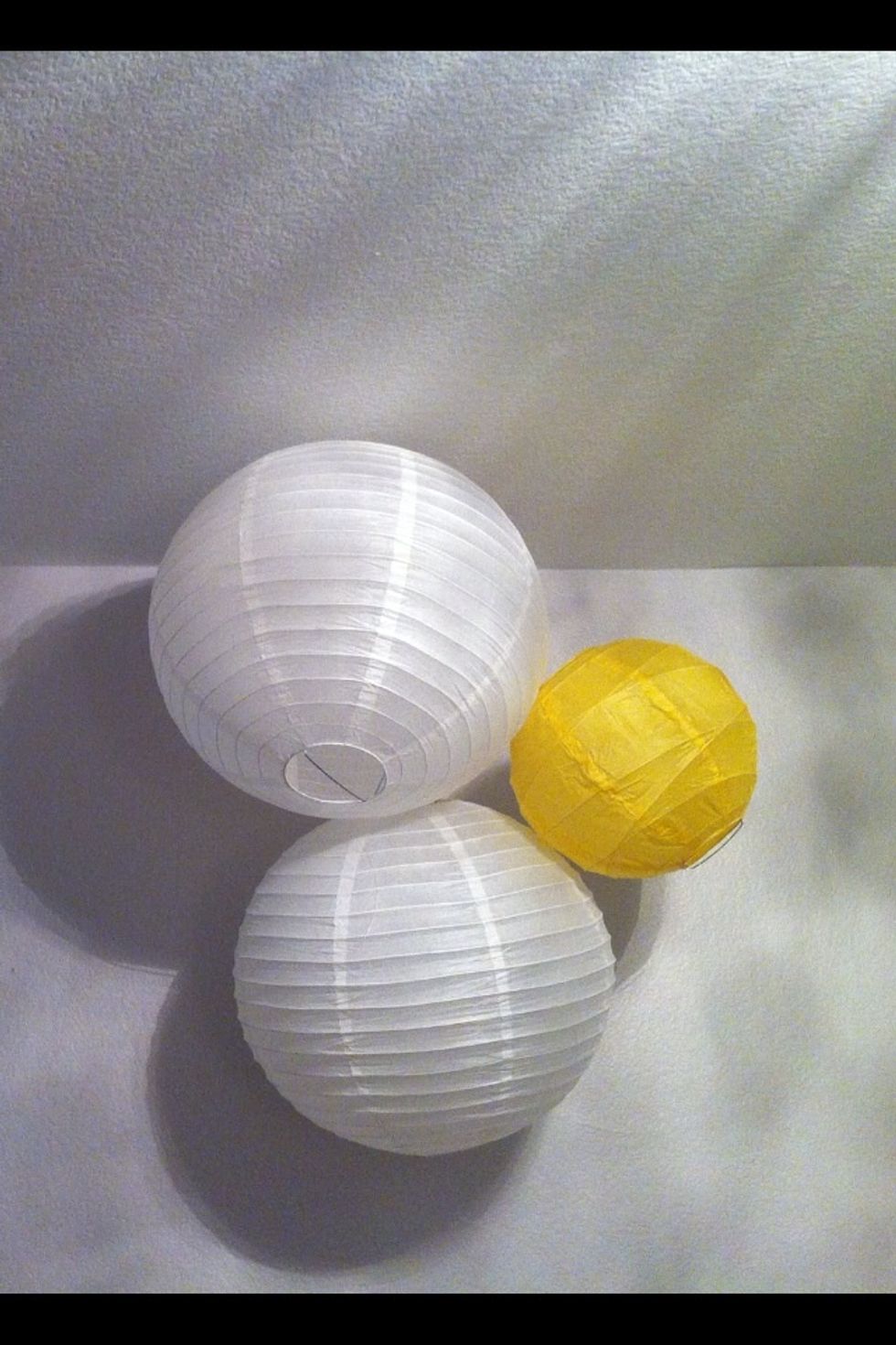 Hang the larger lanterns first to get the shape you'd like.