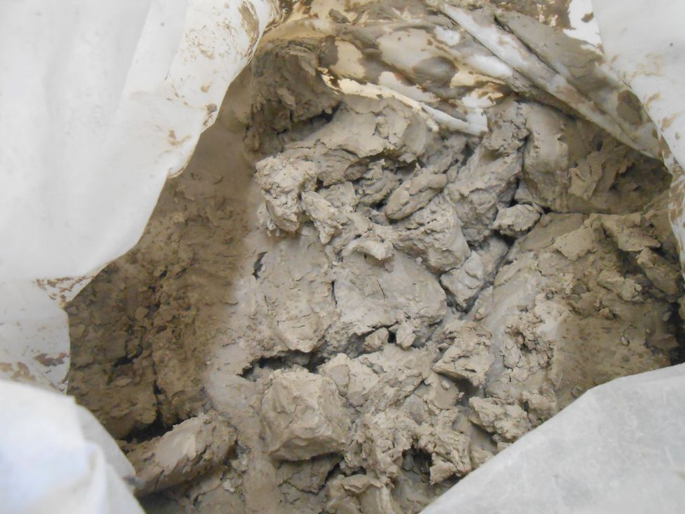 hard clay, beyond leather hard, lots of air pockets, still malleable