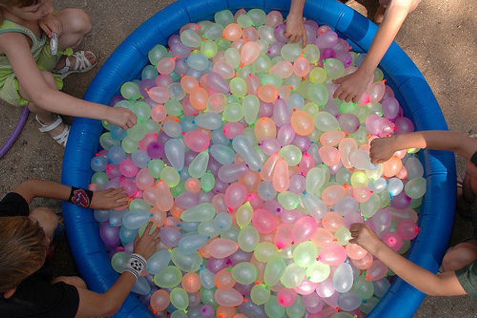 Have a big group of friends and have a huge water balloon fight!