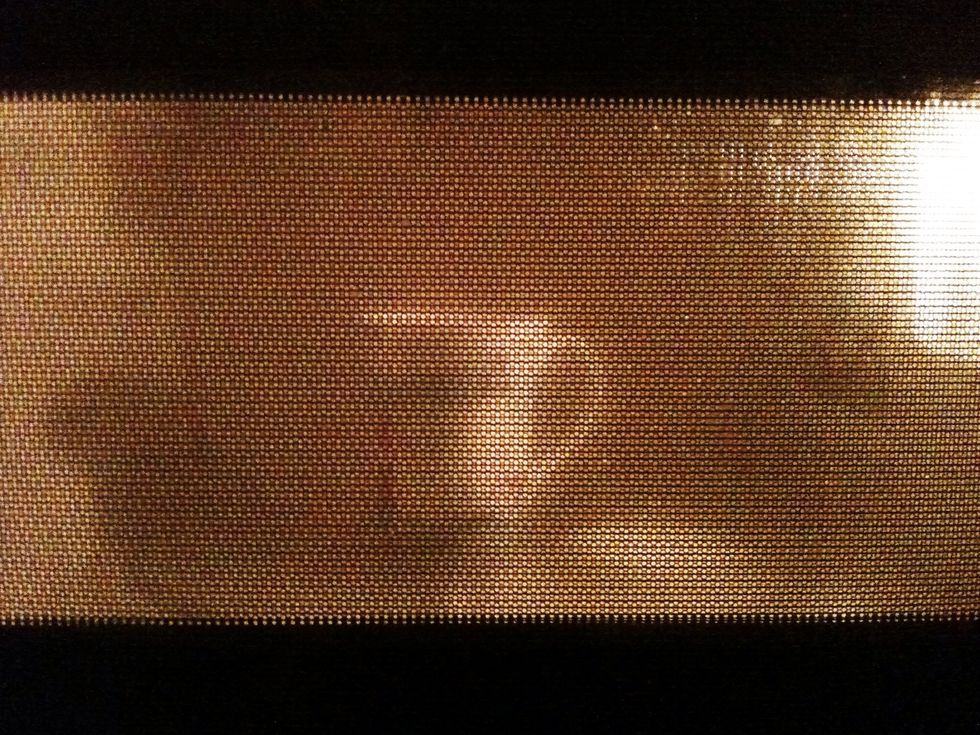 Have a cup filled 2/3 with boiling water, so you leave enough space for the milk. If you have a kettle use it, I don't so I just use the microwave.