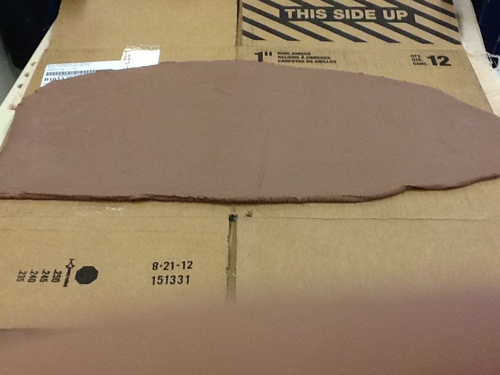 Have a large sheet of cardboard ready so that you can transport your clay back to your working area. Be gentile when you move your clay from the roller to your cardboard.