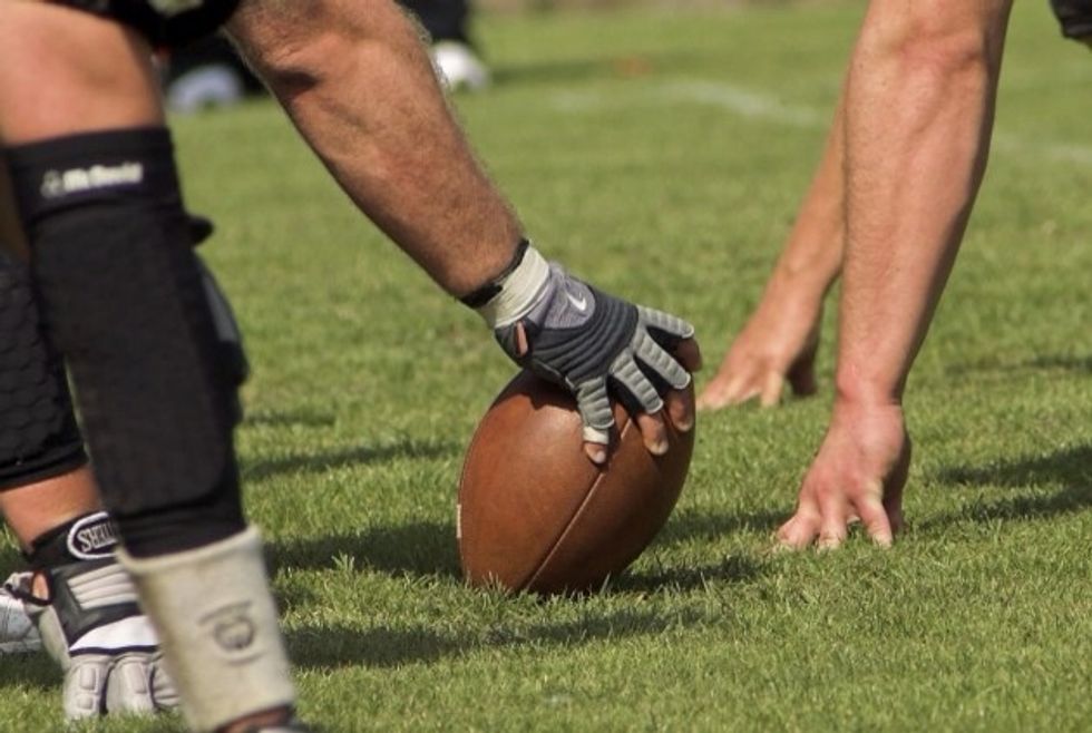 Have a tight grip comfortably on the ball so you don't fumble the snap.