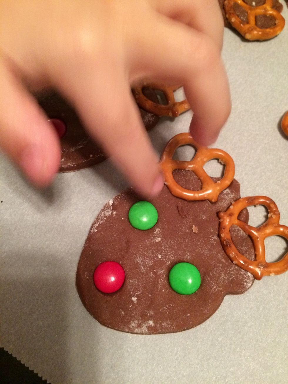 Have children press in 2 green M&M's for eyes