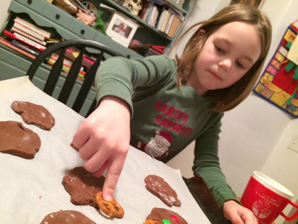 Have children press in mini pretzels for antlers
