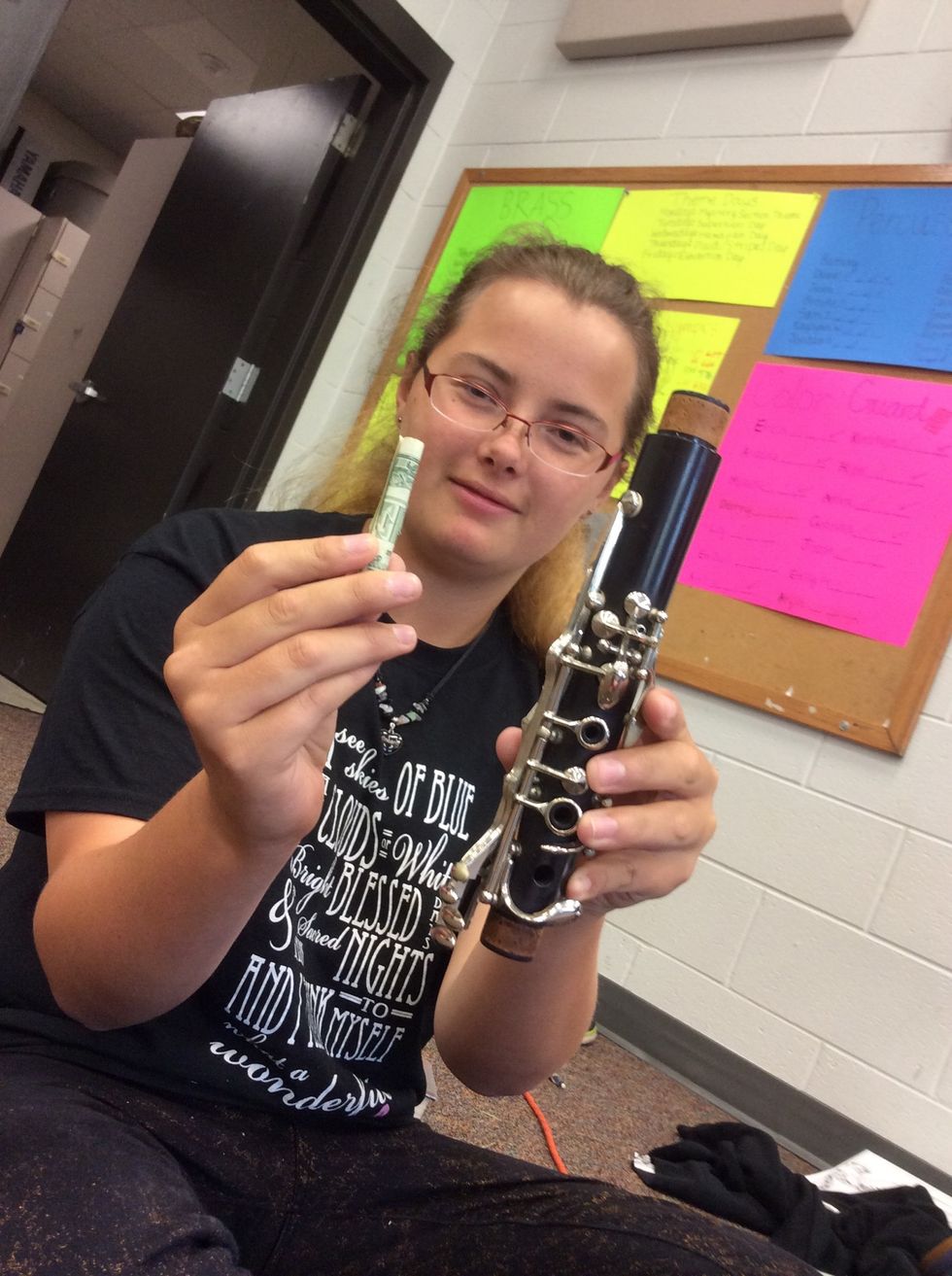 Have rolled dollar bill and top joint of clarinet. You can start anywhere but this part is easier to start at first.