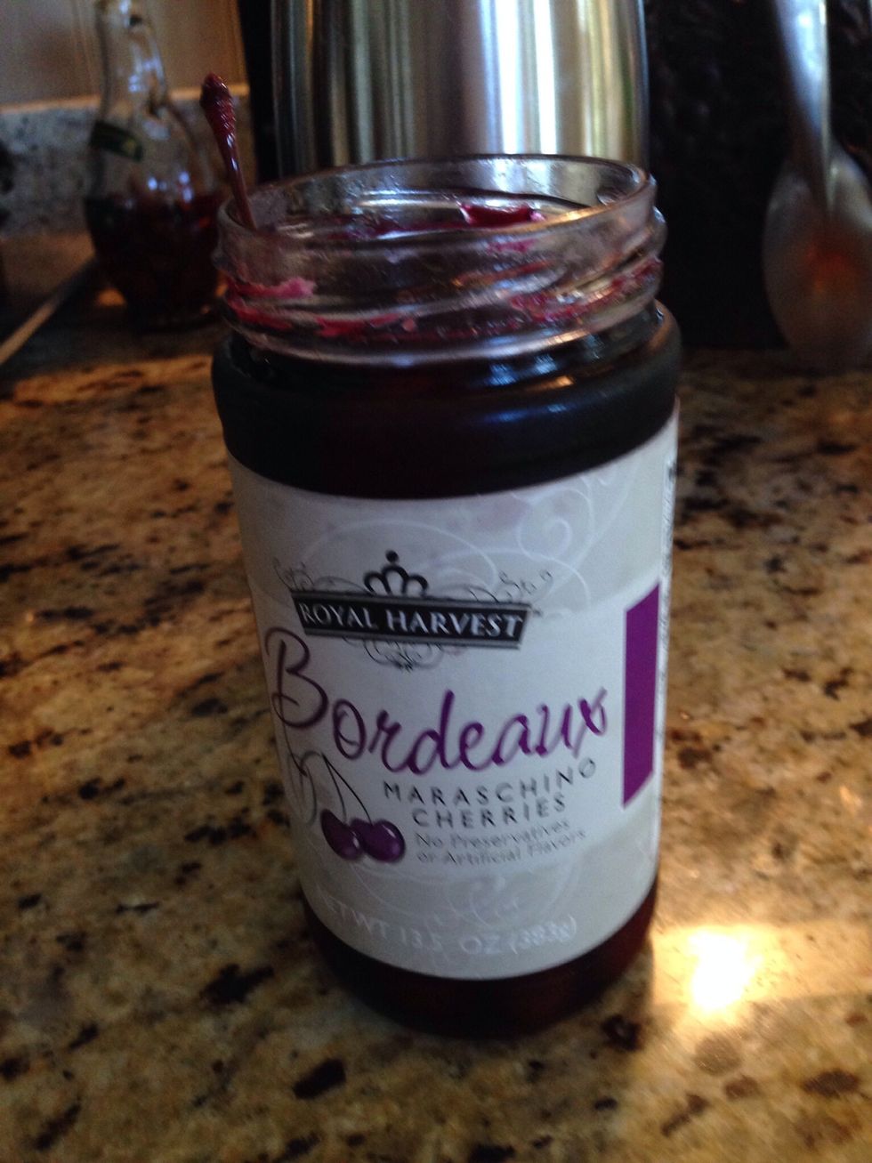 Have the Bordeaux cherries ready. One for each glass.