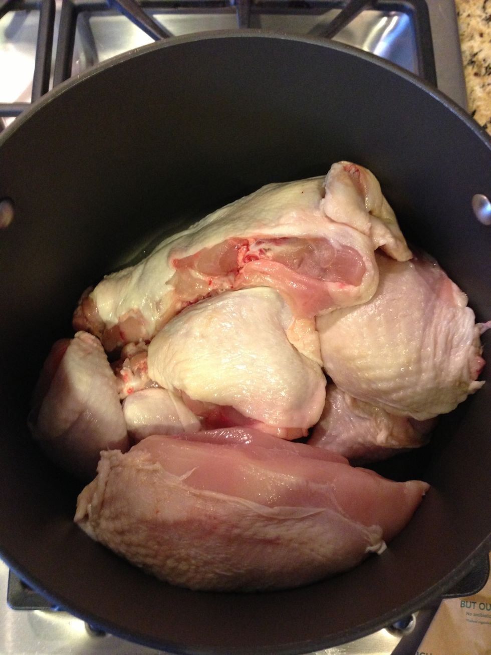 Have the butcher cut a 4-5 pound chicken into pieces. Place the chicken parts in a large pot.