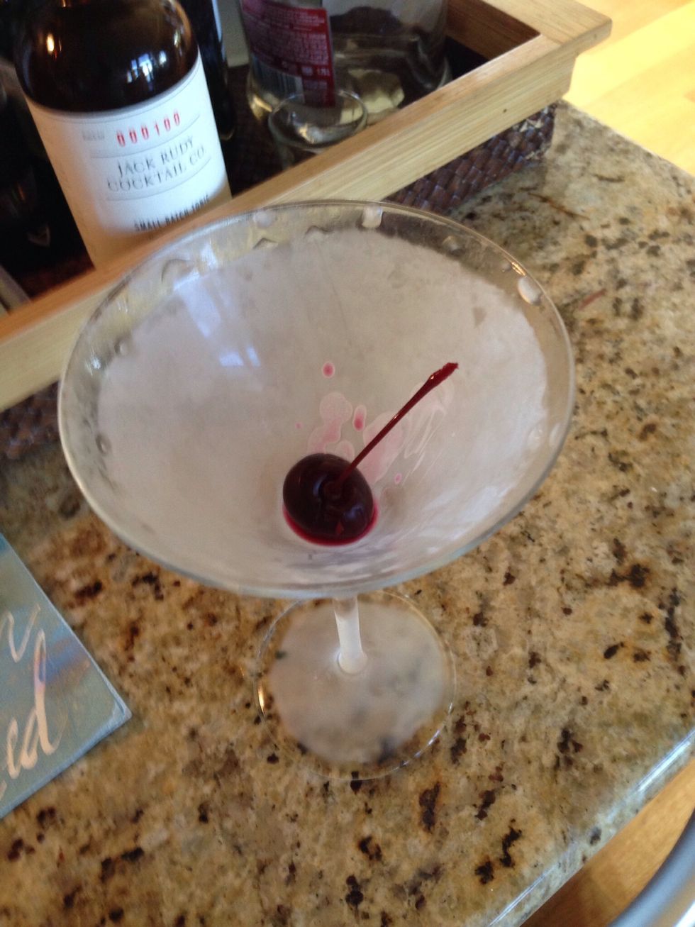 Have the cocktail glasses in the freezer and don't pull them out until you're ready to pour. Add the cherry just before pouring.