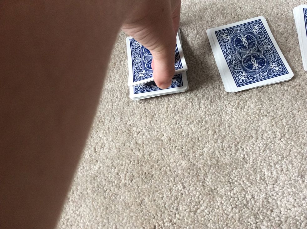 Have the spectator put the cards that they cut onto the first pile