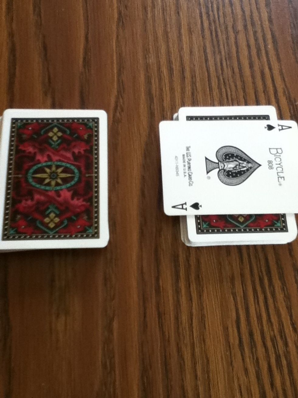 Have them point to a pile then take a card from that pile and memories it.