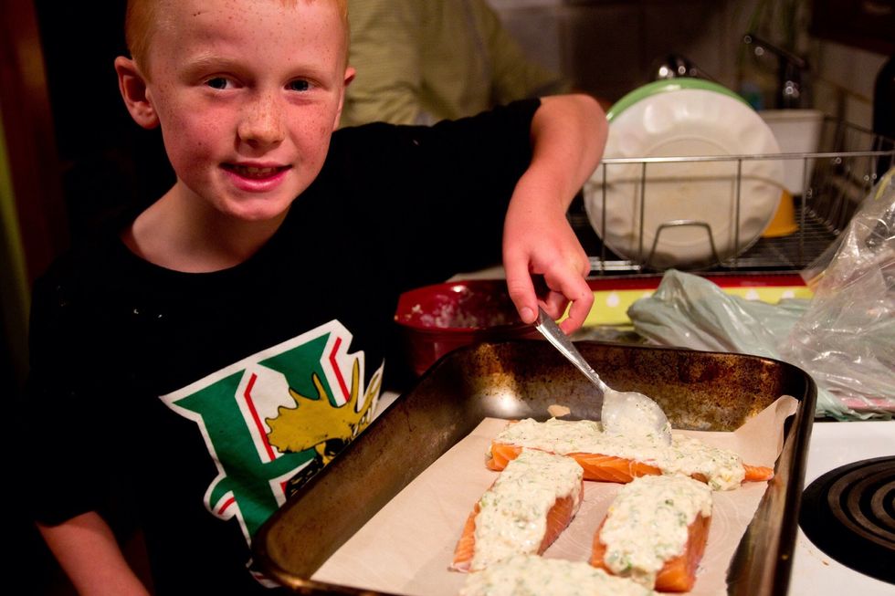 Have your assistant top the salmon with your Parmesan mayo mixture.