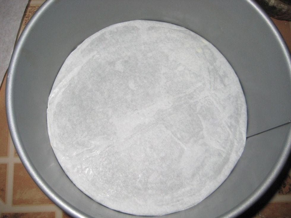 Have your baking tin ready by lining with a parchment paper. You could also at this point set the oven to the 180C/350F mark. This is a 8 inch round baking tin with a loose bottom.