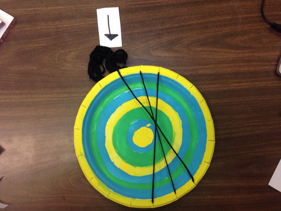 Have your yarn go across the street to make an X. Go to the neighbor to the left of the last string.